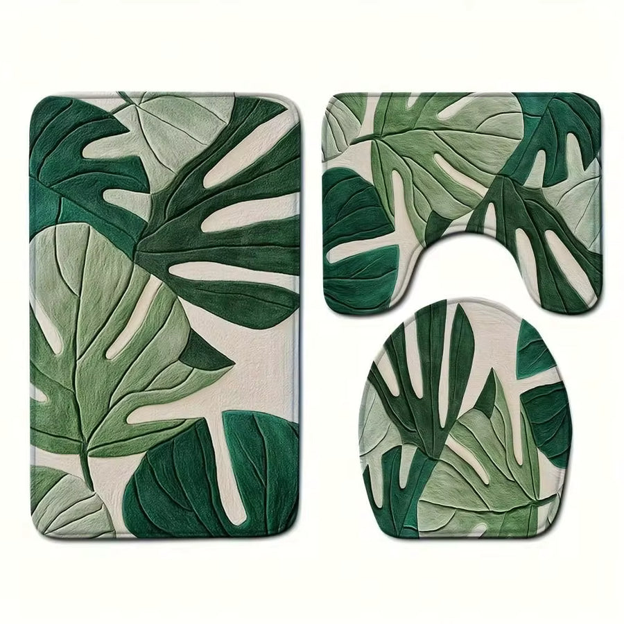 A Set Of Bathroom Short Plush Mats Featuring A Tropical Green Leaf Pattern, Including A Toilet Seat Cover, A U-Shaped Toilet Mat, Made Of Soft Flannel Material, Designed To Be Non-Slip